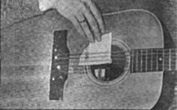 Kottke uses a triangular-shaped piece of paper to stop 